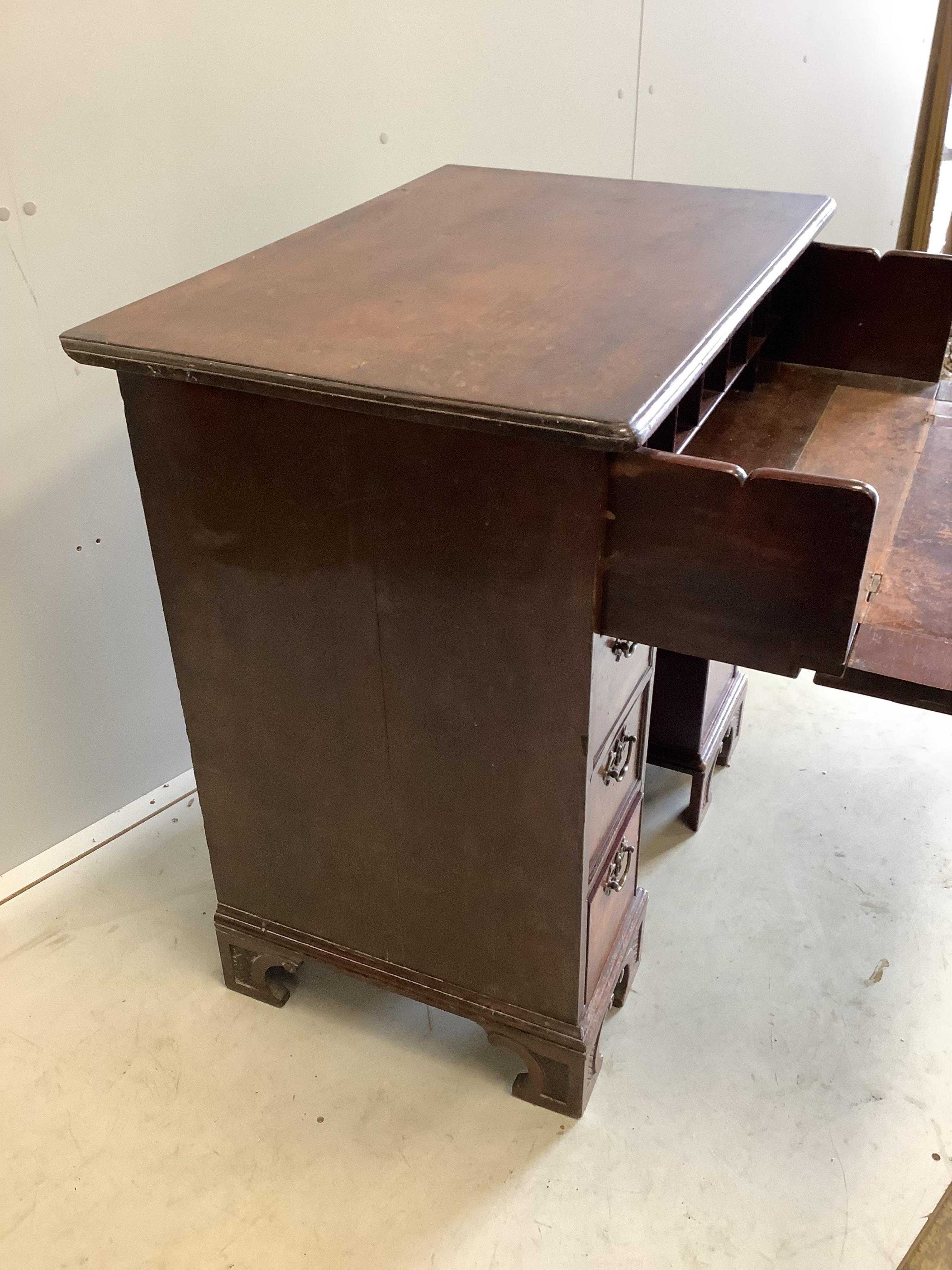 A George III mahogany kneehole desk with later secretaire drawer, width 84cm, depth 55cm, height 87cm. Condition - poor to fair